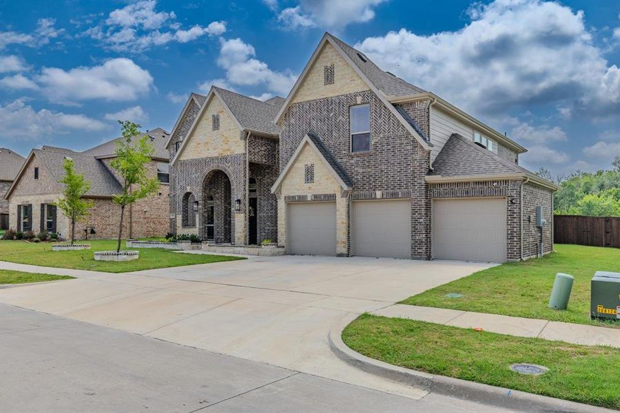 Front exterior of a new home in Grayhawk Addition, Forney, TX, highlighting curb appeal (Image 24).