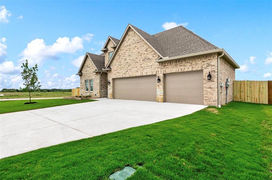 Front exterior of a new home in , Greenville, TX, highlighting curb appeal (Image 20). Front exterior of a new home in , Greenville, TX, highlighting curb appeal (Image 20).