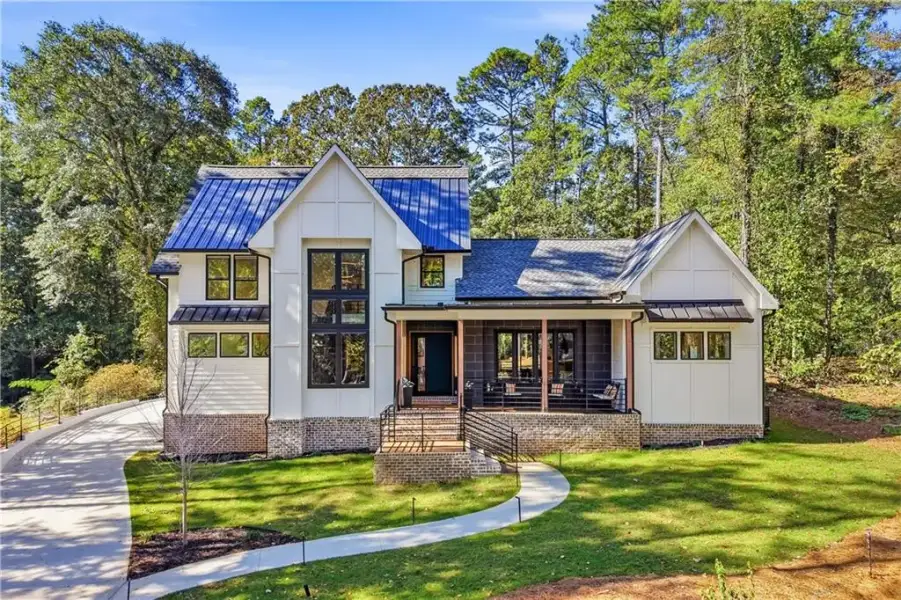 Front exterior of a new home in , Fayetteville, GA, highlighting curb appeal (Image 1). Front exterior of a new home in , Fayetteville, GA, highlighting curb appeal (Image 1).