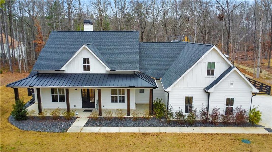 Front exterior of a new home in , Woodstock, GA, highlighting curb appeal (Image 23).