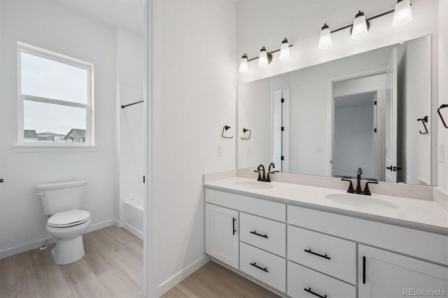 Furnished interior view inside a new home in The Aurora Highlands, Aurora (Image 4).