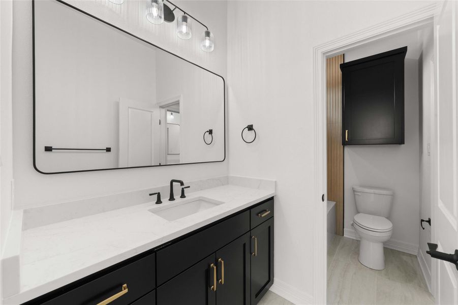 Modern bath boasts sleek vanity, sophisticated fixtures, and a clean, elegant design. Modern bath boasts sleek vanity, sophisticated fixtures, and a clean, elegant design.