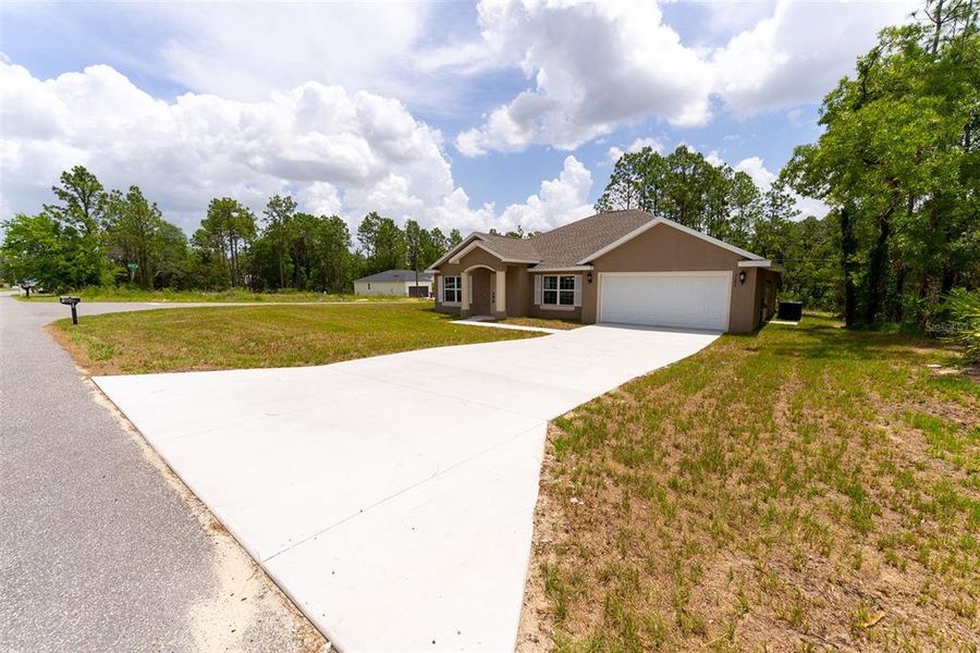 Front exterior of a new home in , Ocala, FL, highlighting curb appeal (Image 2). Front exterior of a new home in , Ocala, FL, highlighting curb appeal (Image 2).