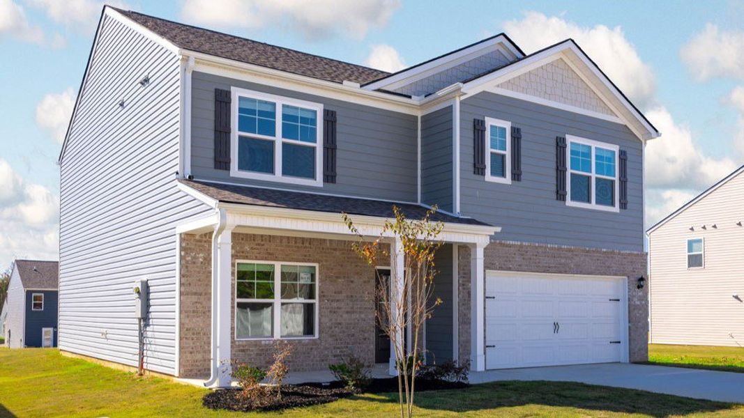 Front exterior of a new home in Hillcrest Landing, McDonald, TN, highlighting curb appeal (Image 2).