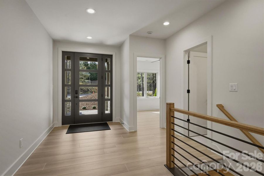 Upon entry, the contemporary design welcomes you. The extra wide flooring is COREtec Originals Premium (Soft Step) collection 9" Wide Luxury Vinyl Plank Flooring offering a modern, clean look that is both durable and low-maintenance. Upon entry, the contemporary design welcomes you. The extra wide flooring is COREtec Originals Premium (Soft Step) collection 9" Wide Luxury Vinyl Plank Flooring offering a modern, clean look that is both durable and low-maintenance.