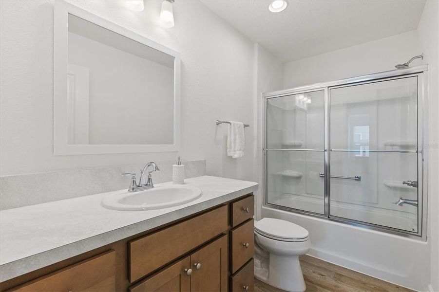 GUEST BATHROOM WITH UPGRADED SHOWER DOORS