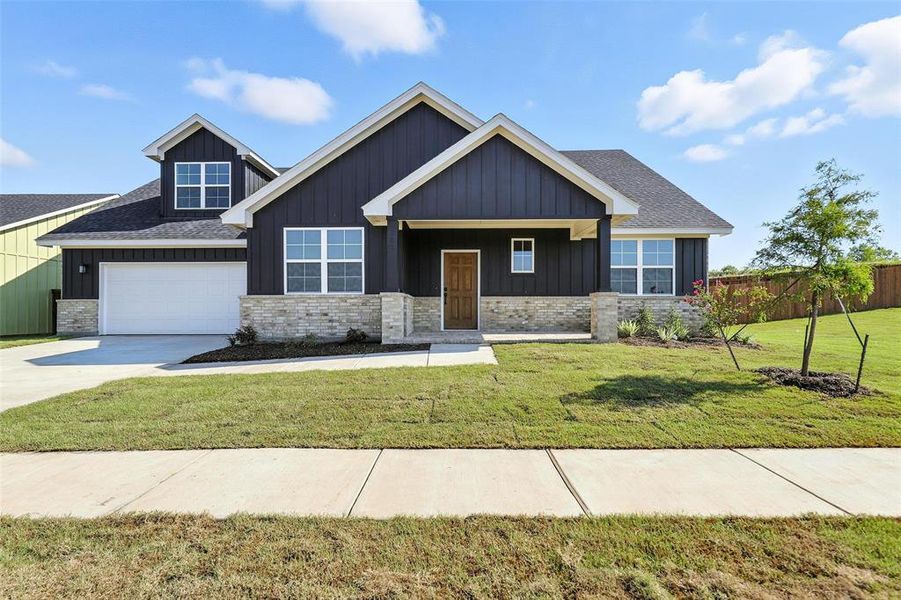 Front exterior of a new home in Stoneview, Glen Rose, TX, highlighting curb appeal (Image 19). Front exterior of a new home in Stoneview, Glen Rose, TX, highlighting curb appeal (Image 19).