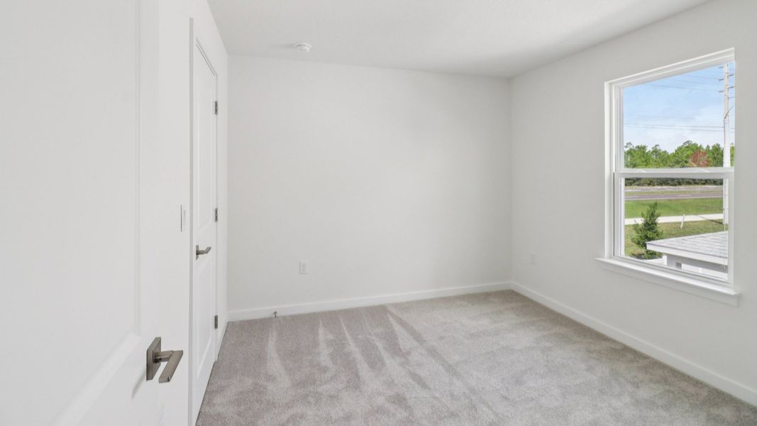 Guest Bed in the Monterey End Townhome by DRB Homes - Cyrene at Harmony in St Cloud FL