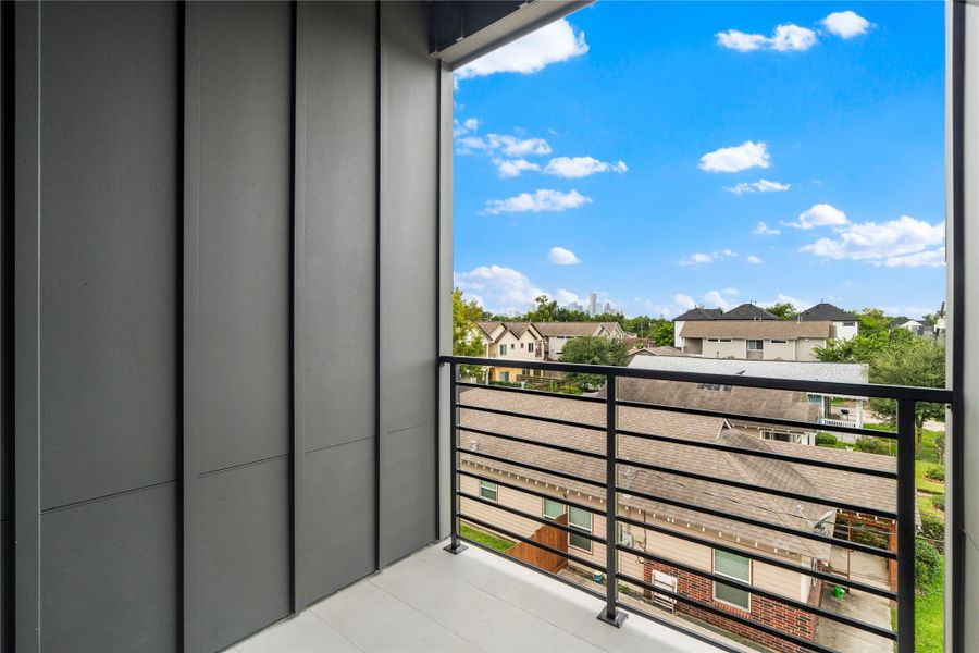 Step out from your primary bedroom onto a private, secluded patio with skyline views. A perfect spot to unwind morning or night. Step out from your primary bedroom onto a private, secluded patio with skyline views. A perfect spot to unwind morning or night.