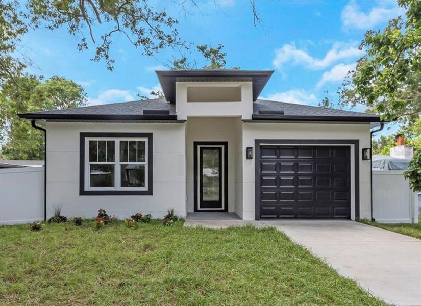 Front exterior of a new home in , Safety Harbor, FL, highlighting curb appeal (Image 1).