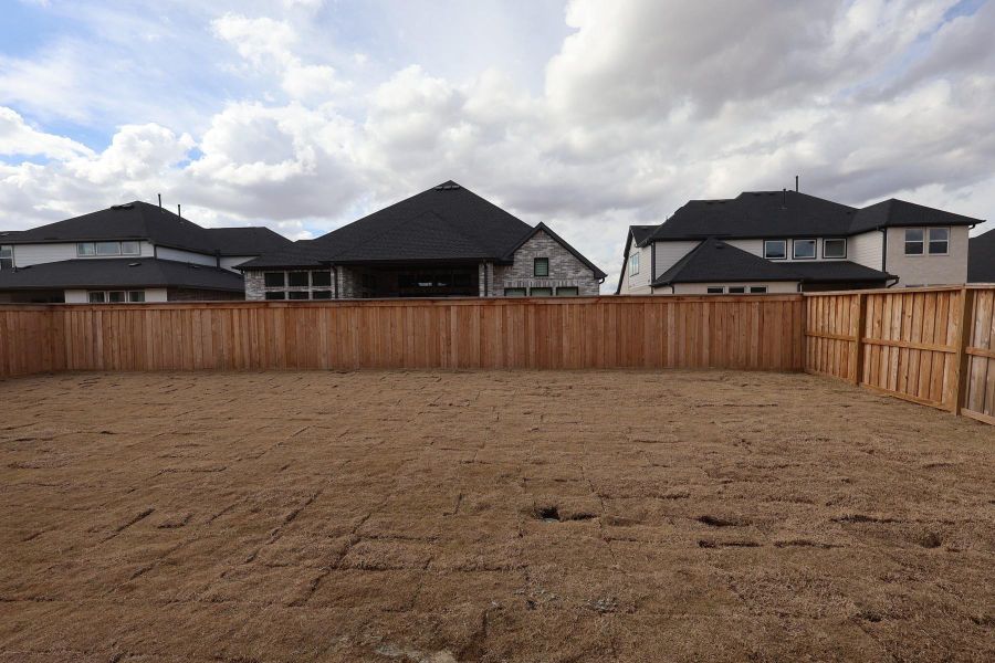 Exterior details and patio area of a home in Dunham Pointe, Cypress (Image 25). Exterior details and patio area of a home in Dunham Pointe, Cypress (Image 25).