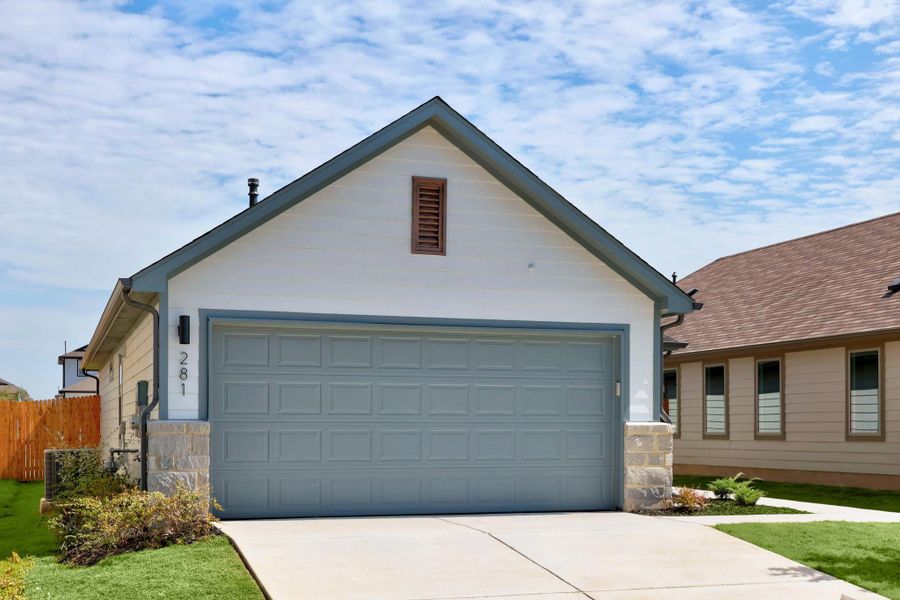 Front exterior of a new home in Trinity Ranch, Elgin, TX, highlighting curb appeal (Image 19).