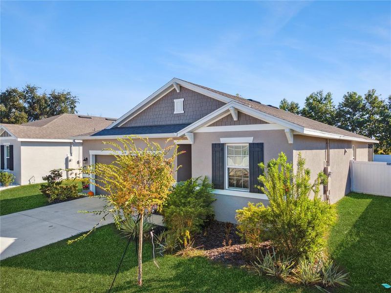 Front exterior of a new home in , Winter Haven, FL, highlighting curb appeal (Image 2).