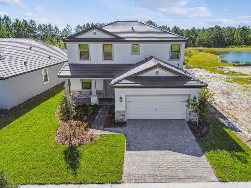 Representative exterior photo of a completed home built from the 50 ' - Saratoga by William Ryan Homes in Tamarack at Two Rivers, Zephyrhills, FL (Image 30).