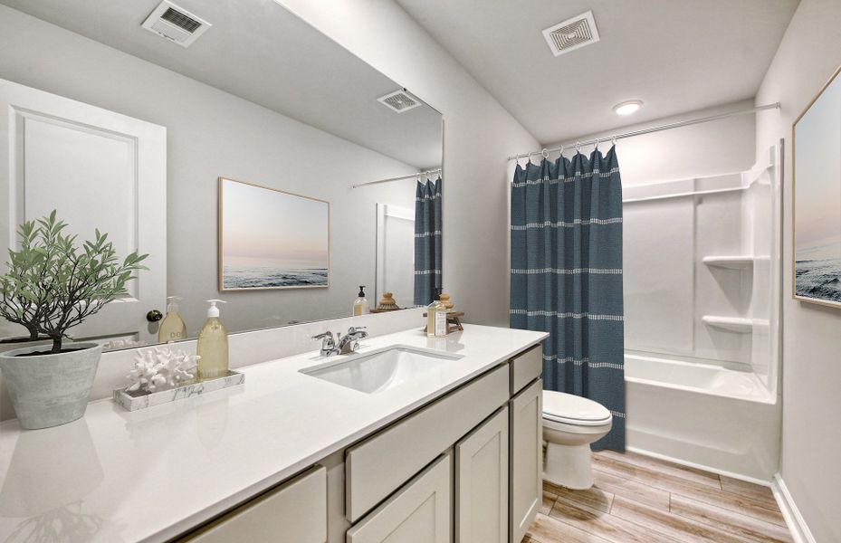 Guest Bathroom in with a tub and a deep bowl sink.