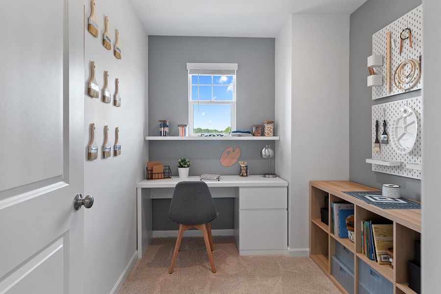 A room with a desk and a chair.