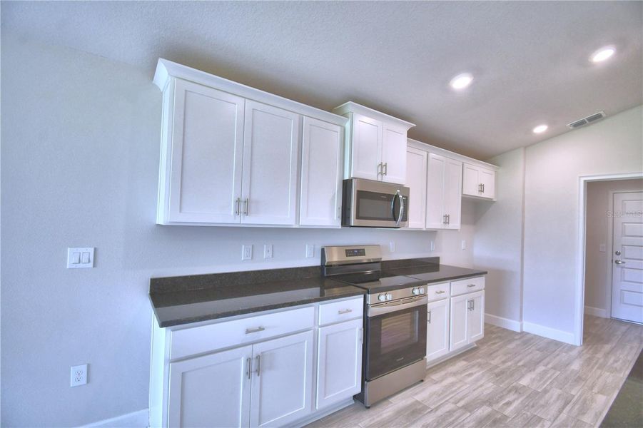 Furnished interior view inside a new home in Lake Juliana Estates, Auburndale (Image 7).