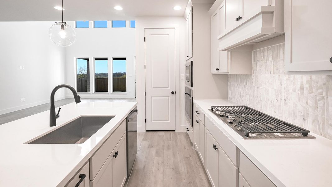 Furnished interior view inside a new home in Crosswinds 50', Kyle (Image 9).