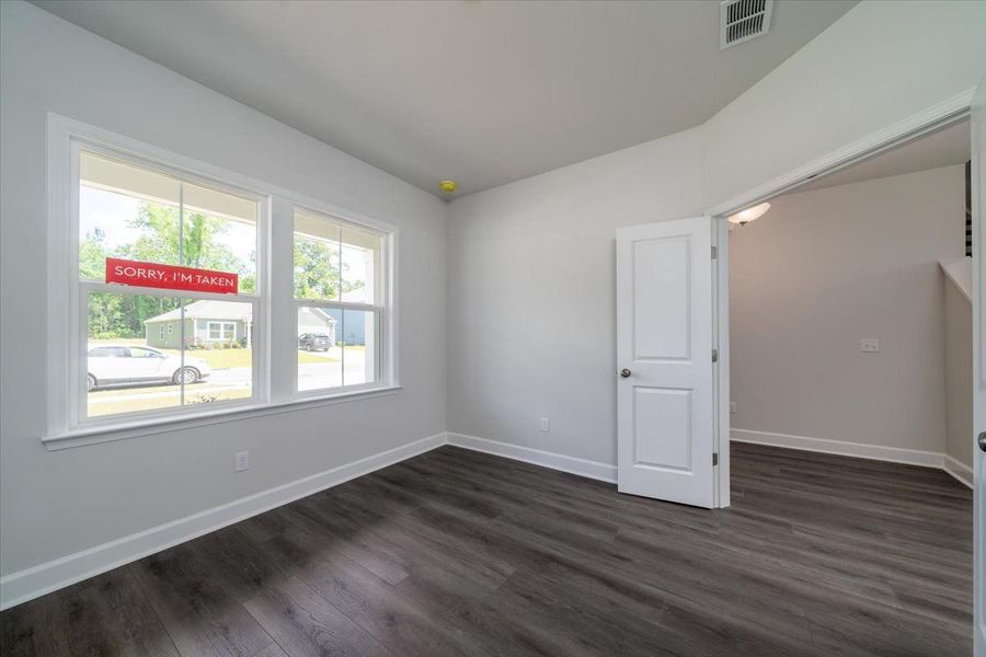 Double doors open to flexible space that can be utilized as a study or home office. Double doors open to flexible space that can be utilized as a study or home office.
