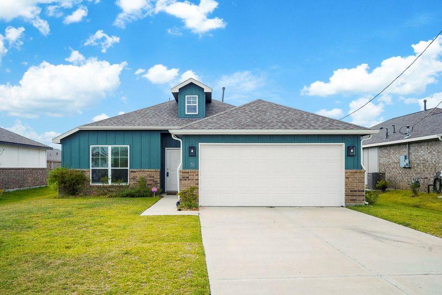 Front exterior of a new home in Santa Fe, Cleveland, TX, highlighting curb appeal (Image 16).