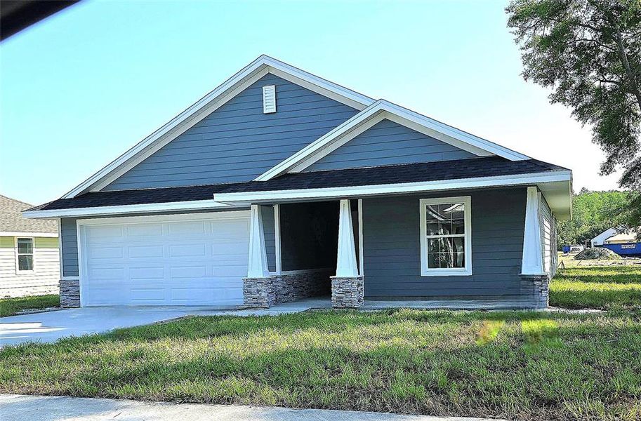 Front exterior of a new home in The Preserve at Laurel Lake, Lake City, FL, highlighting curb appeal (Image 1).