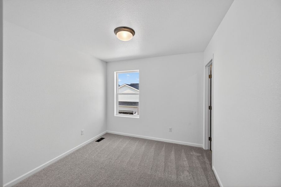 Spacious, unfurnished interior of a new home in Sky Ranch, Watkins (Image 12).