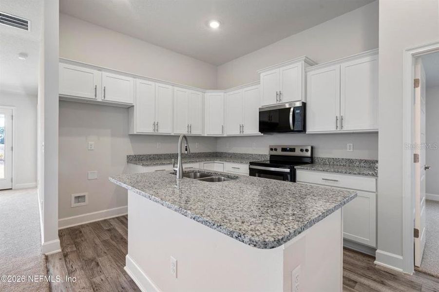 Furnished interior view inside a new home in Palm Coast, Palm Coast (Image 3). Furnished interior view inside a new home in Palm Coast, Palm Coast (Image 3).