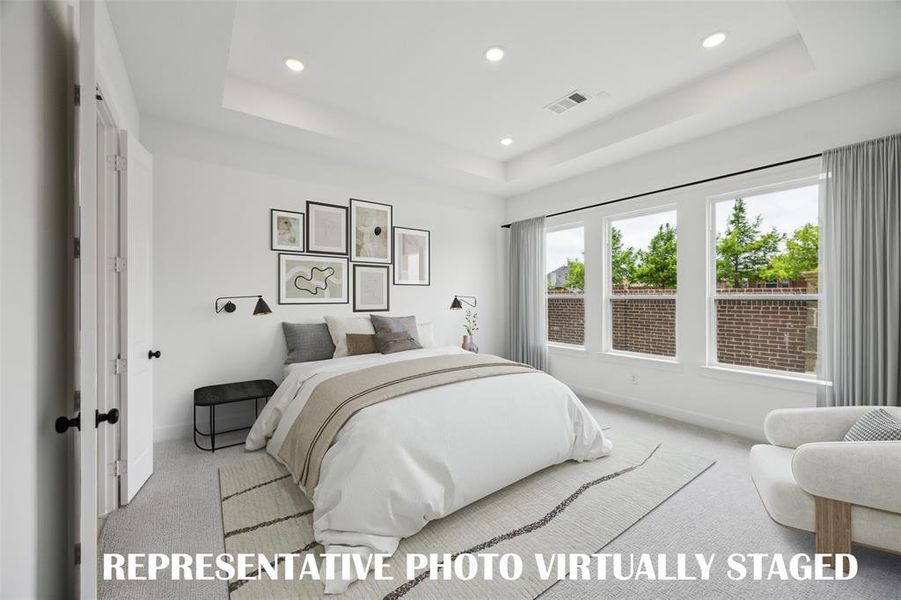 Located at the rear of the home for additional privacy, this owner's suite was designed for rest and relaxation.     REPRESENTATIVE PHOTO VIRTUALLY STAGED