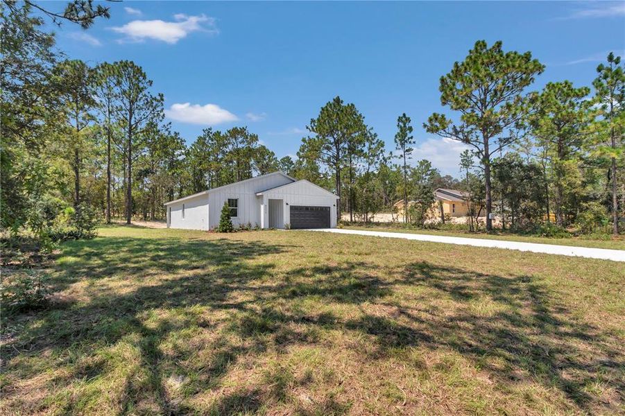 Front exterior of a new home in , Dunnellon, FL, highlighting curb appeal (Image 26). Front exterior of a new home in , Dunnellon, FL, highlighting curb appeal (Image 26).