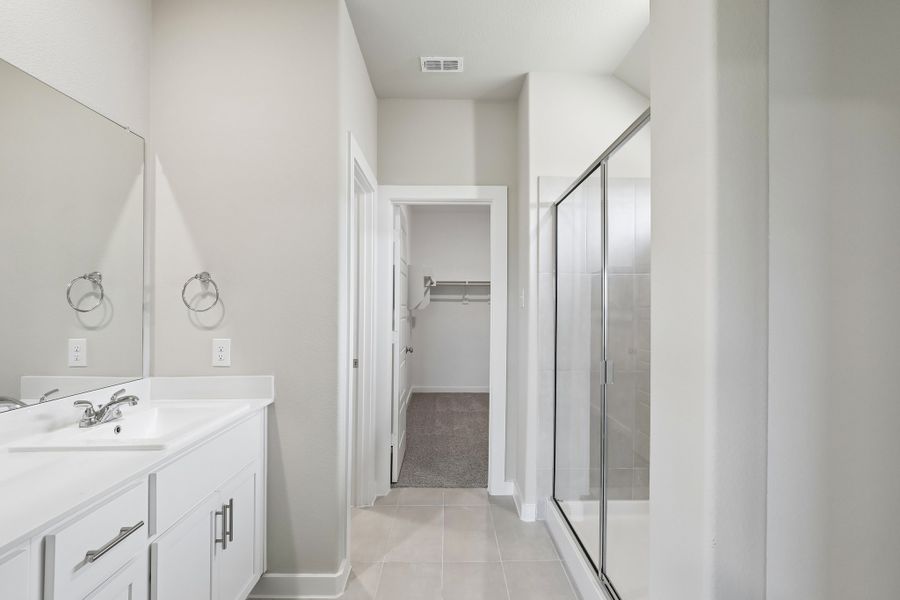 Primary Bathroom in the Oscar home plan by Trophy Signature Homes