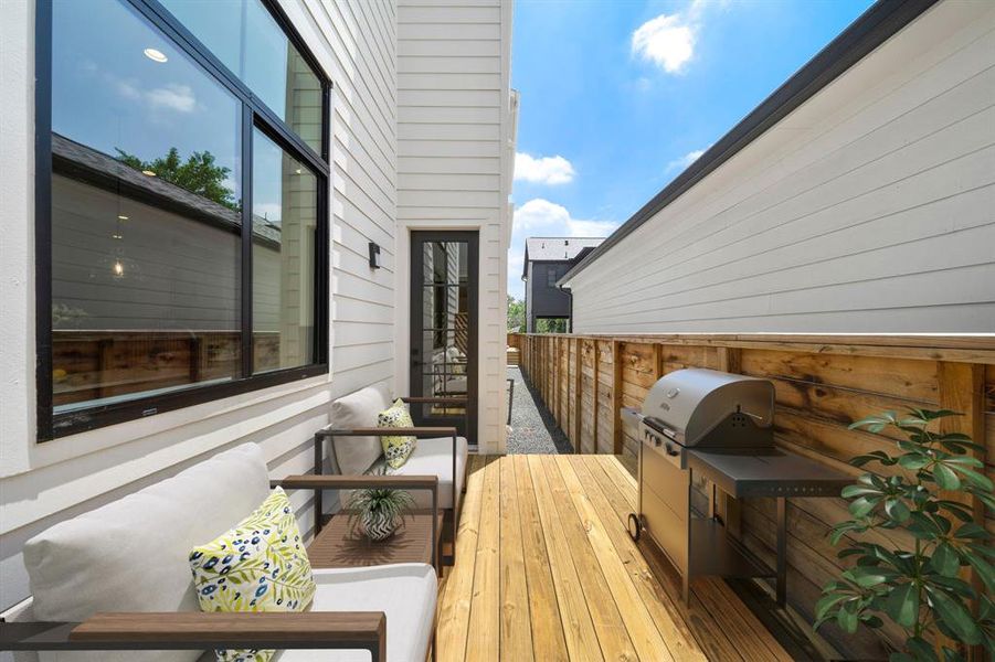 Enjoy outdoor living and entertaining on your private rear deck. Furniture and grill shown in photo is virtually staged.