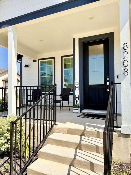 Love at first sight with this COVERED porch & front door!!