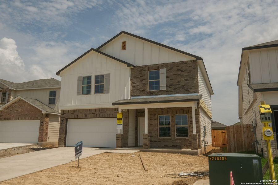 Front exterior of a new home in Blue Ridge Ranch, San Antonio, TX, highlighting curb appeal (Image 17). Front exterior of a new home in Blue Ridge Ranch, San Antonio, TX, highlighting curb appeal (Image 17).