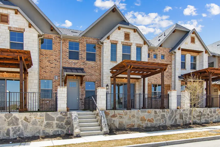 Front exterior of a new home in The Tribute, The Colony, TX, highlighting curb appeal (Image 1). Front exterior of a new home in The Tribute, The Colony, TX, highlighting curb appeal (Image 1).