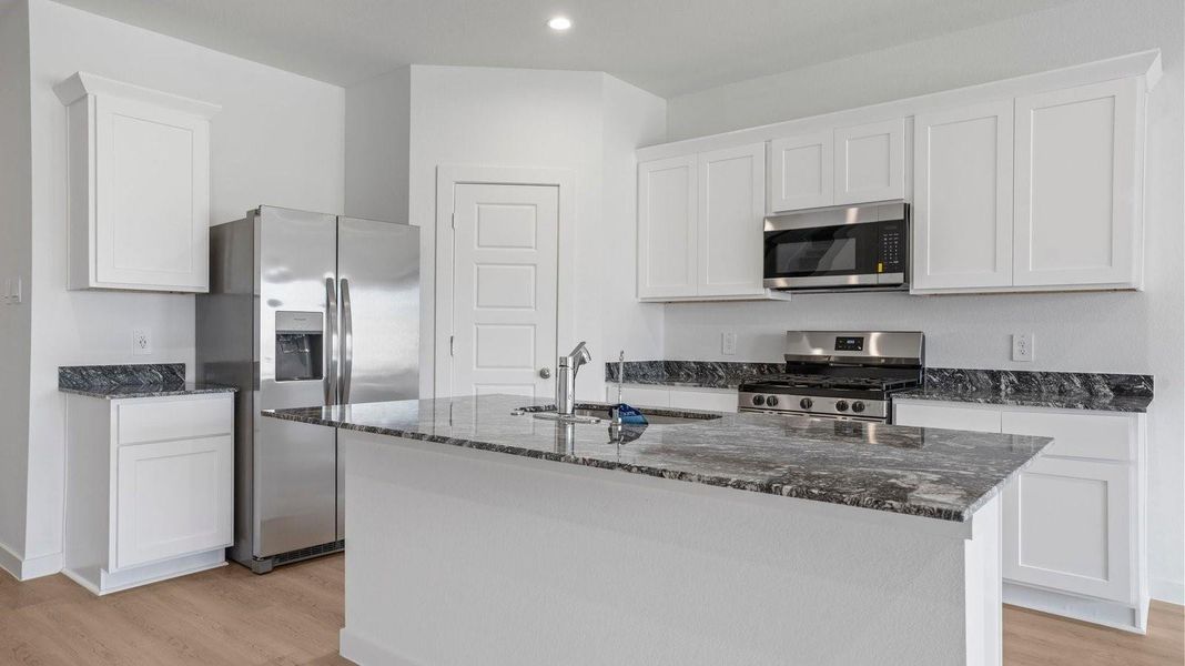 Furnished interior view inside a new home in Caldwell Crossing, Iowa Colony (Image 3).