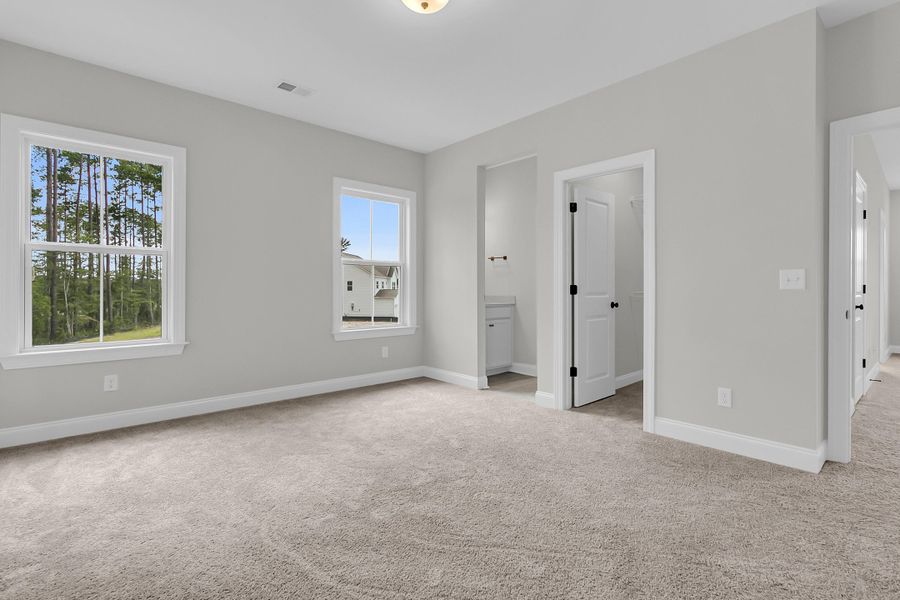 Spacious, unfurnished interior of a new home in Tidewater at Lakes of Cane Bay, Summerville (Image 47).