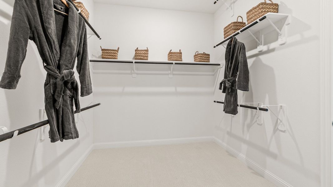 Representative furnished interior of a home built from the Rosewood by Brightland Homes in Sunterra, Katy (Image 16).