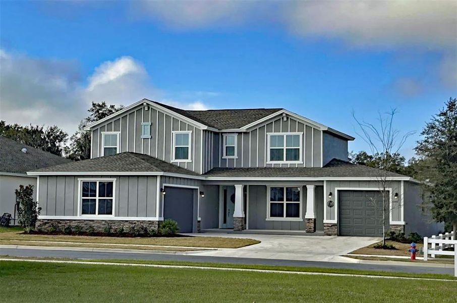Front exterior of a new home in Calesa Township, Ocala, FL, highlighting curb appeal (Image 22).