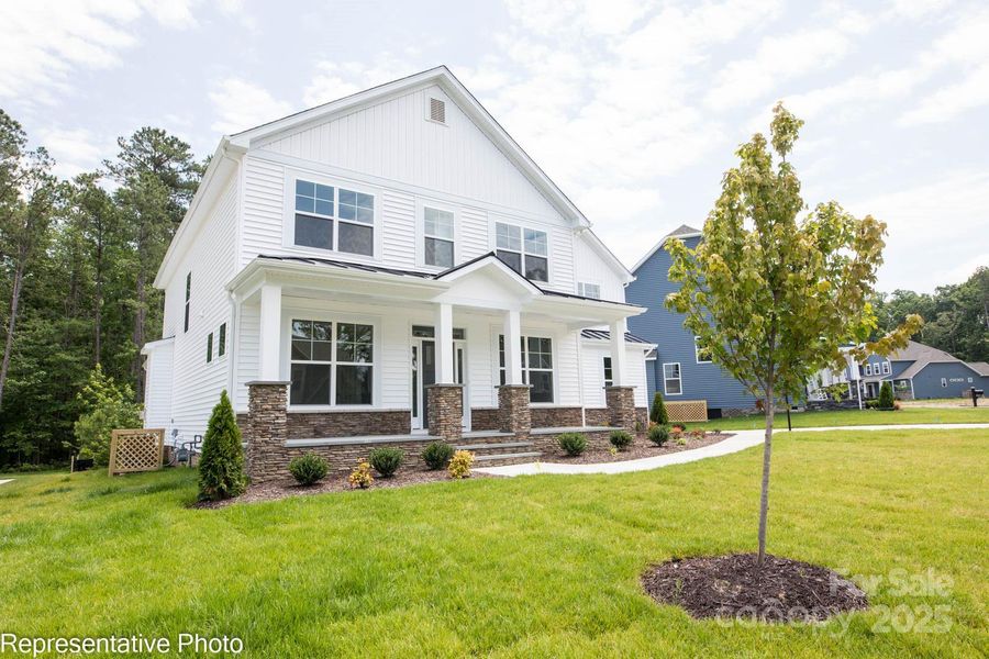 Homesite 36 features a Colfax plan/B elevation. Home in photo is shown on a crawl space foundation. Homesite 36 is built on a slab foundation.