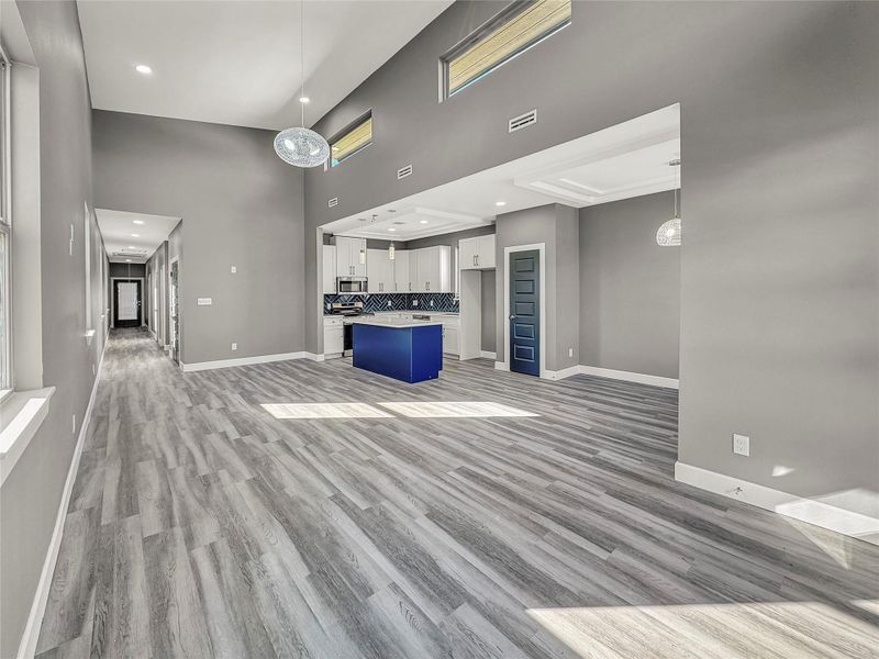 Bright open-concept living and dining area with high ceilings