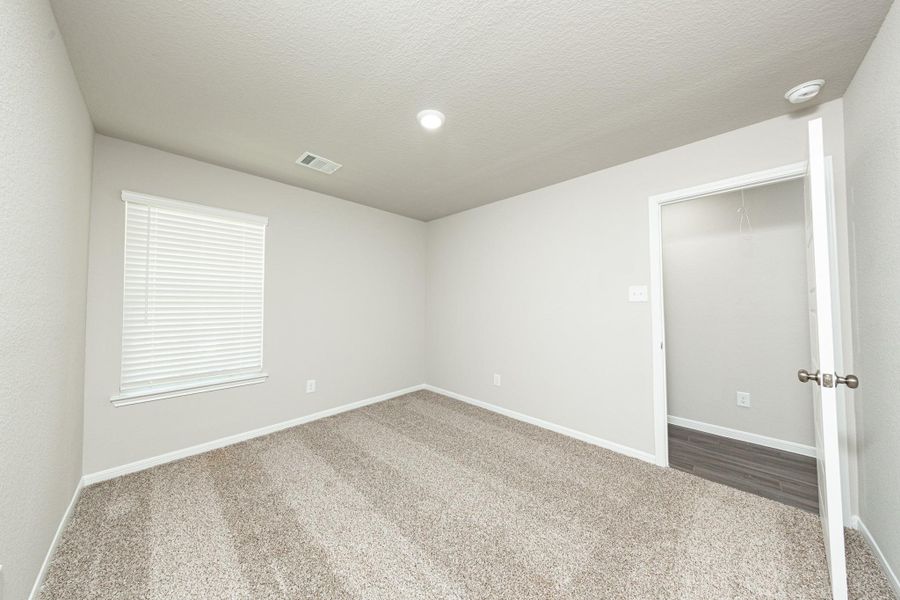Spacious, unfurnished interior of a new home in Mackenzie Creek, Conroe (Image 26). Spacious, unfurnished interior of a new home in Mackenzie Creek, Conroe (Image 26).