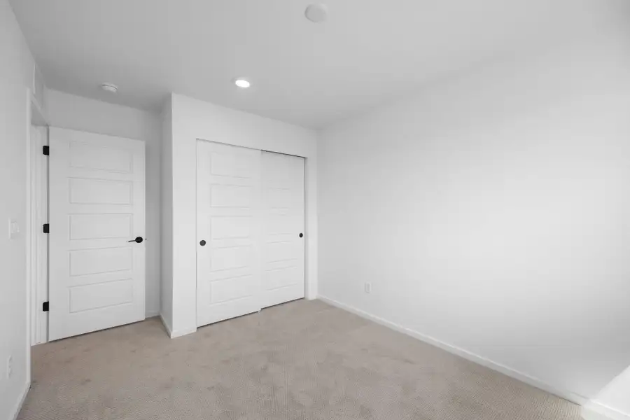Spacious, unfurnished interior of a new home in Sky Ranch, Watkins (Image 11).