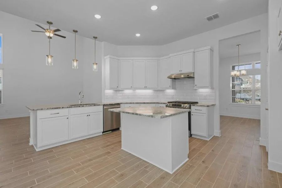 Representative furnished interior of a home built from the Emma by Chesmar Homes in Bridgeland, Elgin (Image 11).