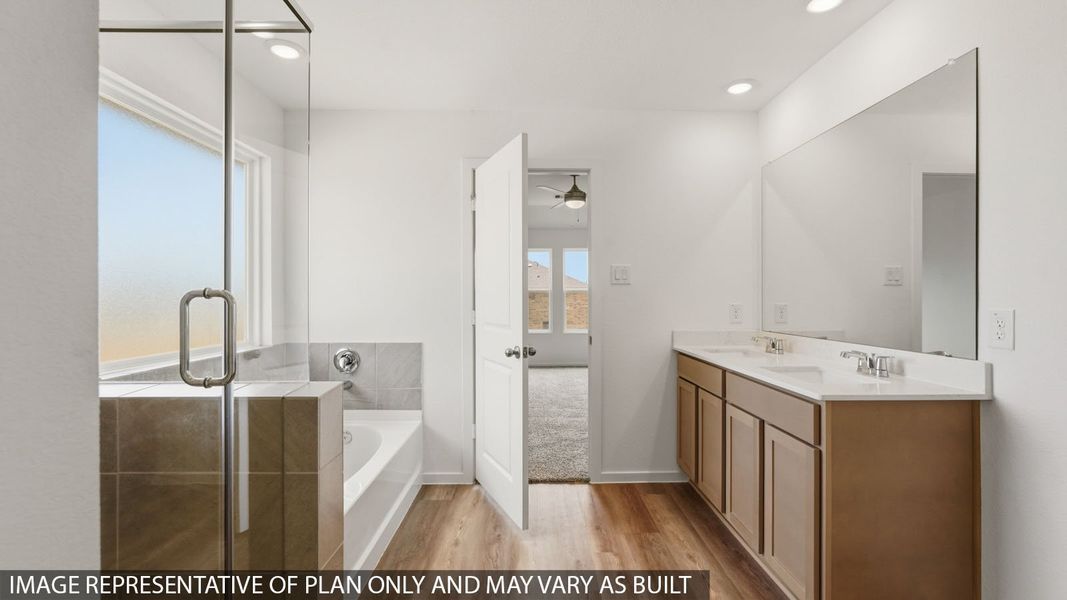 Furnished interior view inside a new home in Sunterra, Katy (Image 11).