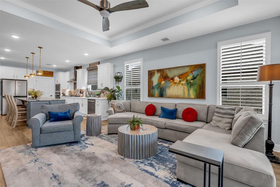 There is plentiful space in living room with featured tray ceiling. There is plentiful space in living room with featured tray ceiling.