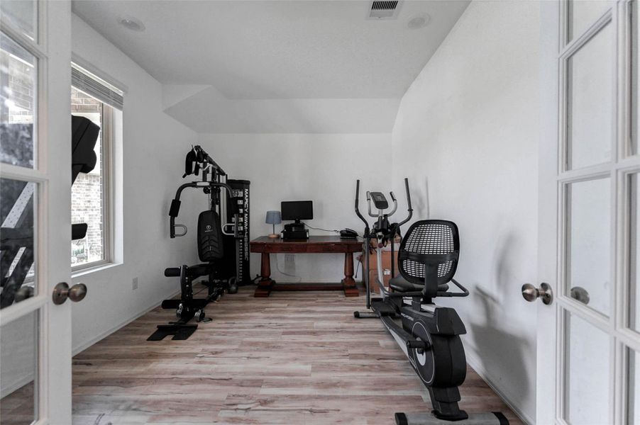 Light-filled flex room with wood-look floors and French doors—ideal for home gym, office, or playroom! Located in Sunterra, one of Katy TX’s top master-planned communities. Light-filled flex room with wood-look floors and French doors—ideal for home gym, office, or playroom! Located in Sunterra, one of Katy TX’s top master-planned communities.