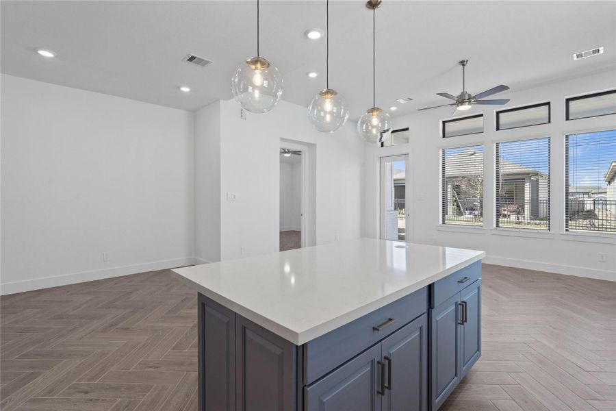 The intentional open design fosters a deep sense of connection between all three primary living zones. Sightlines remain clear from the sink to the sofa, promoting inclusive living and effortless entertaining.