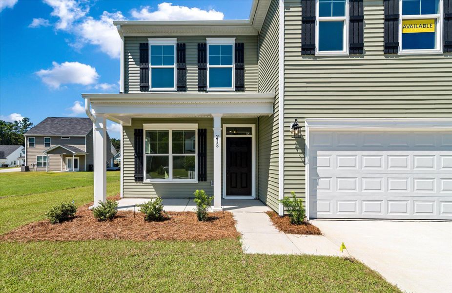 Exterior details and patio area of a home in Oakley Pointe, Moncks Corner (Image 3). Exterior details and patio area of a home in Oakley Pointe, Moncks Corner (Image 3).