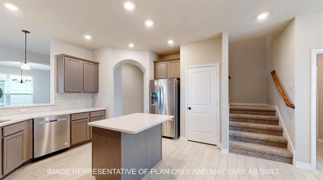 Kitchen featuring pendant lighting, a kitchen island, recessed lighting, stainless steel appliances, and backsplash Kitchen featuring pendant lighting, a kitchen island, recessed lighting, stainless steel appliances, and backsplash