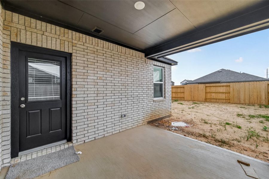 Exterior details and patio area of a home in Sunterra, Katy (Image 4).